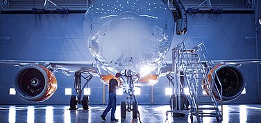 Airplane in a production hall.